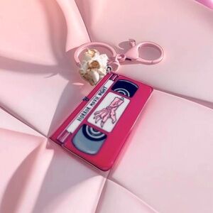 "Fright Night Fun: Pink Horror Movie Keychain with Popcorn Charm"